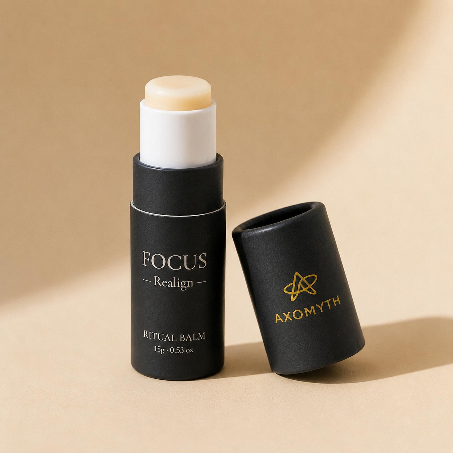 AXOMYTH FOCUS ritual balm, cap removed, balm visible on the push-up mechanism