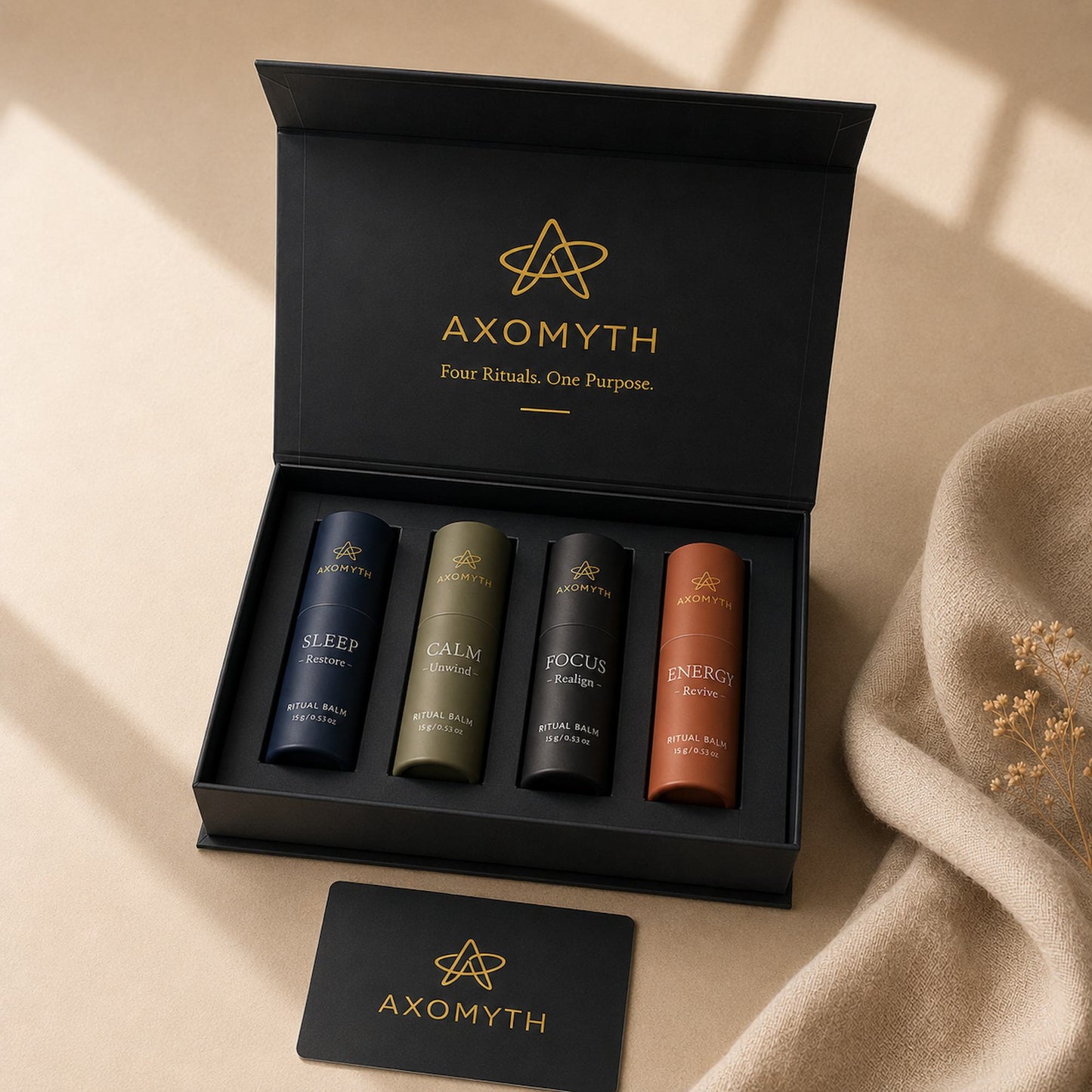 AXOMYTH Complete Ritual Set box open, showing all four ritual balms and signature card